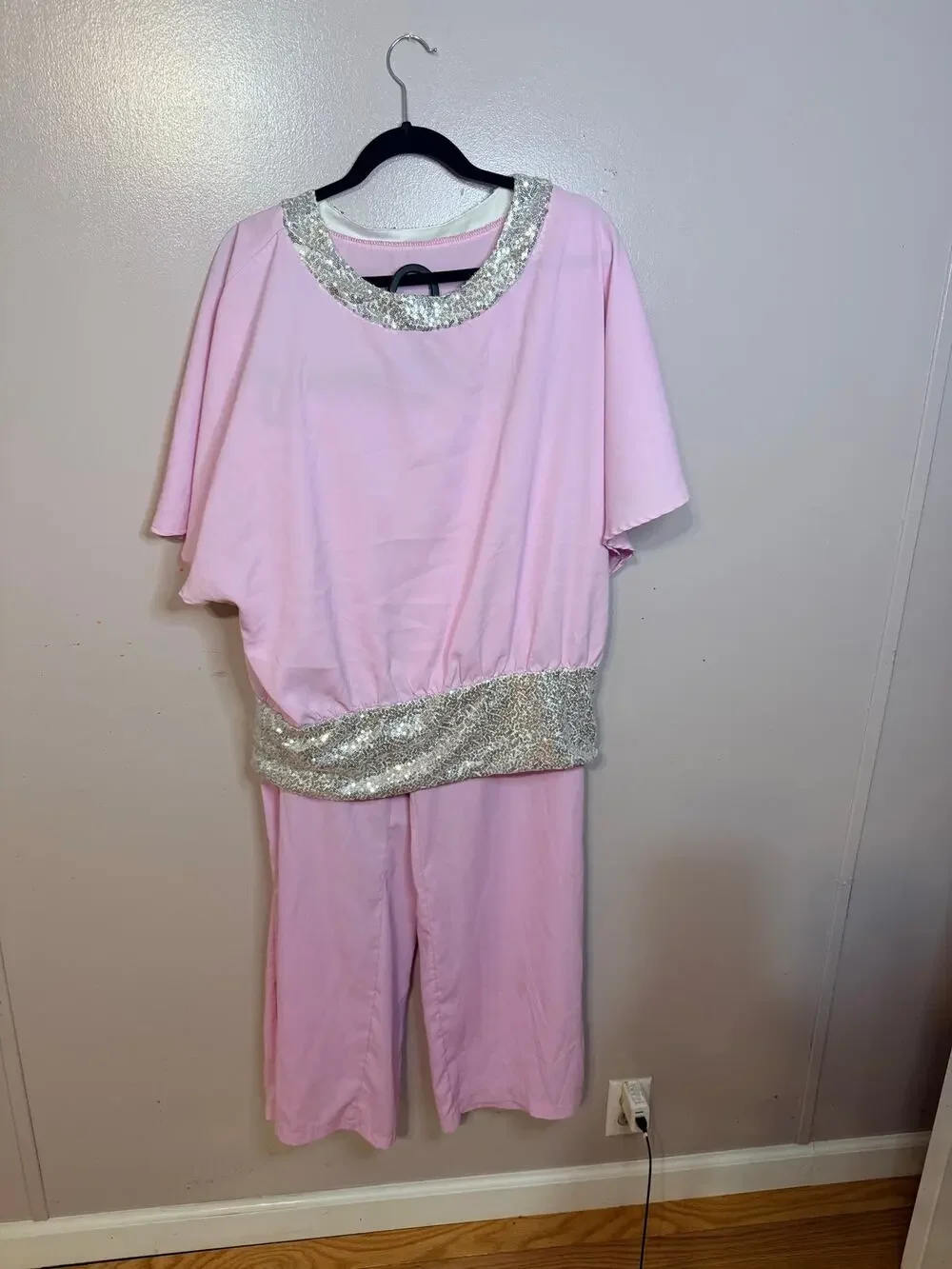 Pink two-piece batwing-sleeve pantsuit. Sparkling silver sequin trim. Size L.